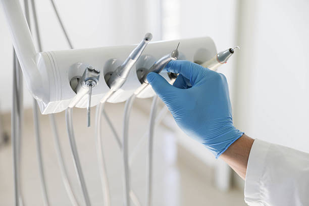 Professional Tooth Extraction technician working in East Lansing, MI